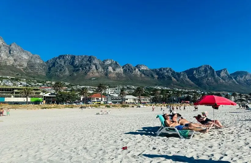 People on the beach with mountains in the background, Cape Town, South Africa