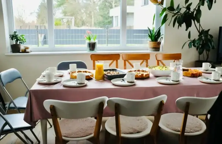 A table set for multiple people with breakfast foods. Brunch table, meal