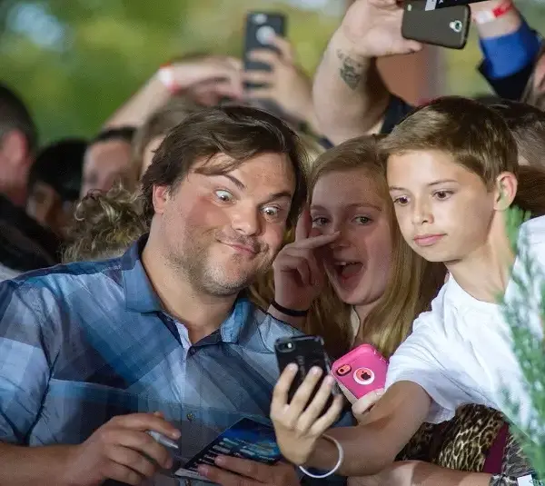 Actor Jack Black takes selfies with fans while walking the red carpet during an early screening of the Goosebumps movie benefiting Variety, The Children's Charity of Eastern Tennessee, at the Regal Pinnacle Stadium 18 movie theater in Knoxville 24, 2015.