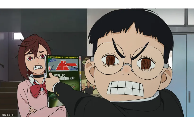 Dan Da Dan Okarun is showing Momo a magazine