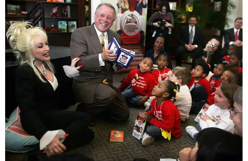Surprise guest Dolly Parton, left, showed up with Gov. Phil Bredesen to kick off the Imagination Library by reading stories to children at the downtown Metro Library on March 15, 2005. Davidson County now will be able to take part in her national literary program.
