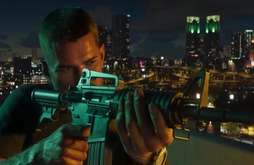 Character from Rockstar's GTA 6 holding a rifle on a rooftop at night, with a city skyline illuminated by colorful lights in the background, conveying tension and focus.