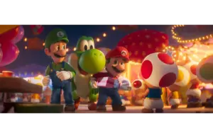 Mario, Luigi, Yoshi, and Toad joyfully walk through a festive, brightly lit market. Mario holds a gift, while Toad offers a red lollipop in The Super Mario Galaxy Movie