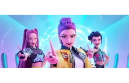 Three animated characters from "KPop Demon Hunters" pose confidently in a futuristic setting with vibrant lighting. They point forward, exuding energy and determination. KPop Demon Hunters is nominated for a Golden Globe