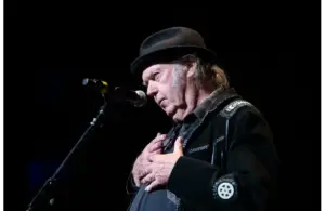 Neil Young helps to induct his longtime collaborator and friend Spooner Oldham into the Memphis Music Hall of Fame during a ceremony. Young played his first show 63 years ago today on January 31, 1963.