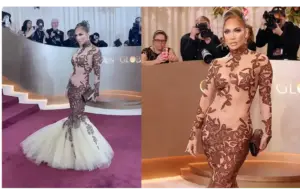 Jennifer Lopez in a form-fitting, long-sleeve gown with intricate brown lace and a white mermaid tulle bottom poses on a red carpet. Photographers capture the moment, highlighting a glamorous vibe at the Golden Globes 2026.