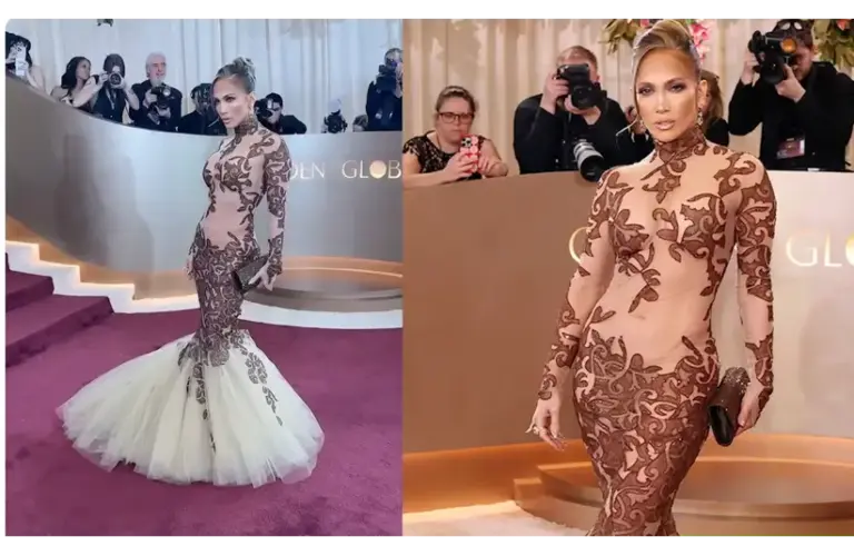 Jennifer Lopez in a form-fitting, long-sleeve gown with intricate brown lace and a white mermaid tulle bottom poses on a red carpet. Photographers capture the moment, highlighting a glamorous vibe at the Golden Globes 2026.