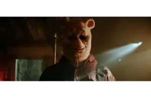 Image of Craig David Dowsett in "Winnie-the-Pooh: Blood and Honey"(2023), the first installment to "Poohniverse"