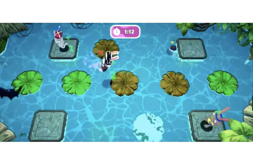 A colorful, multi-player, family-friendly video game scene in Running Fable Petite Party with cartoon characters jumping on lily pads over water. Timer shows 1:12 remaining, creating a sense of urgency.