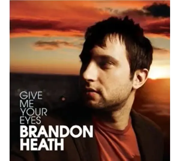 Brandon Heath stands at sunrise on the atwork of his single "Give Me Your Eyes."
