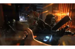 A person engages in combat with a futuristic armored soldier in a dimly lit, industrial setting. Sparks fly as weapons clash, creating a tense atmosphere. Wolfenstein: The Old Blood, Courtesy of MachineGames and Bethesda Softworks. This is not footage of Wolfenstein 3.