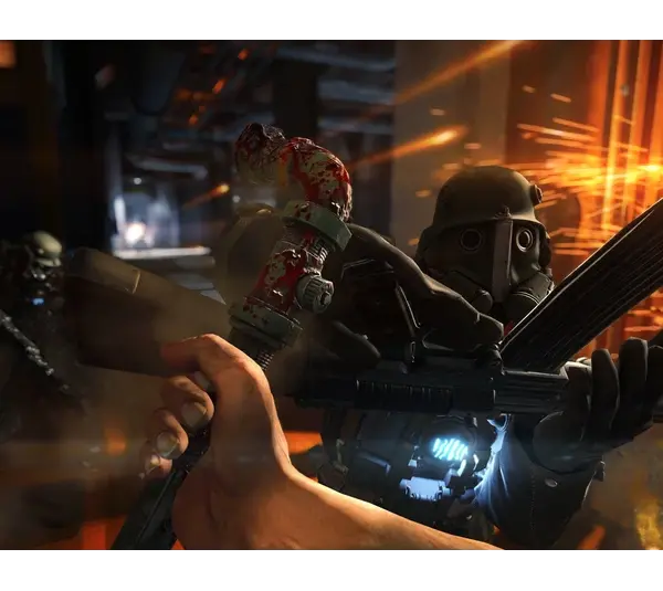 A person engages in combat with a futuristic armored soldier in a dimly lit, industrial setting. Sparks fly as weapons clash, creating a tense atmosphere. Wolfenstein: The Old Blood, Courtesy of MachineGames and Bethesda Softworks. This is not footage of Wolfenstein 3.