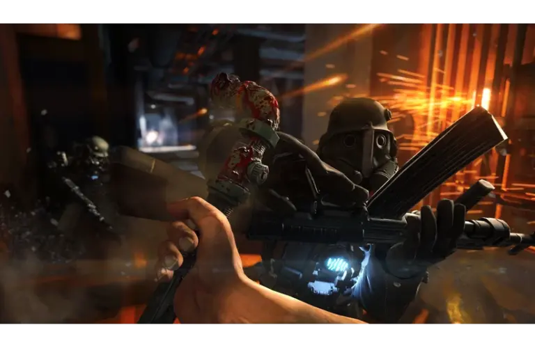 A person engages in combat with a futuristic armored soldier in a dimly lit, industrial setting. Sparks fly as weapons clash, creating a tense atmosphere. Wolfenstein: The Old Blood, Courtesy of MachineGames and Bethesda Softworks. This is not footage of Wolfenstein 3.