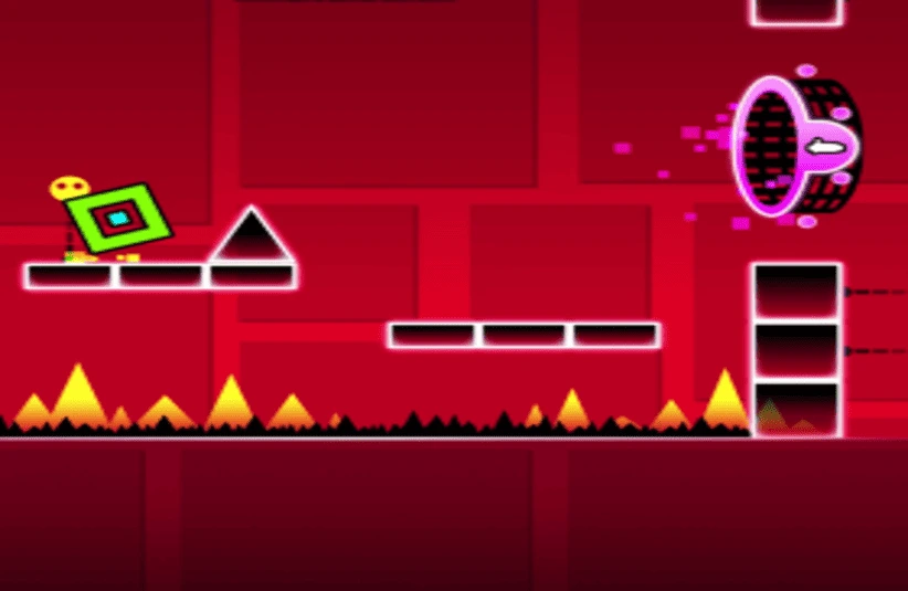 A vibrant red game scene in Geometry Dash features a green square character tilting on a platform near a black triangle, with spikes below and a glowing portal ahead.