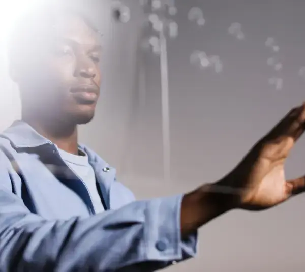 A person reaches out towards floating bubbles. Use of somatic tools.