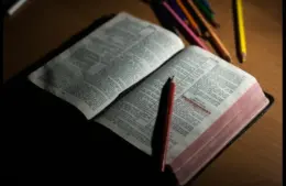 Daily devotion shows an open Bible with pen and highlights.