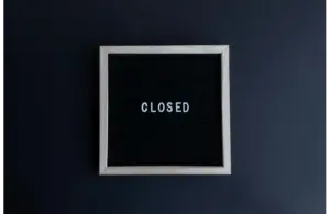 closed sign board for red robin