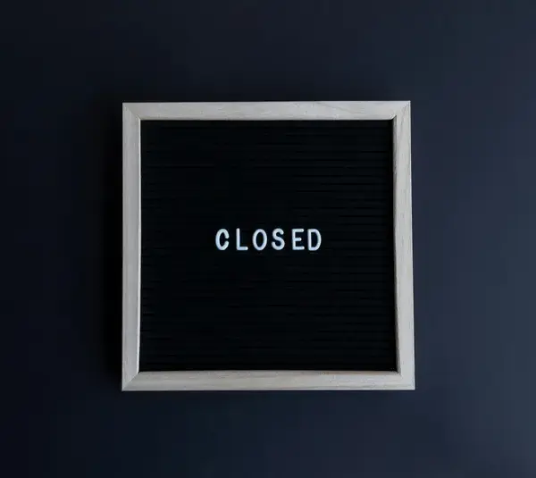 closed sign board for red robin