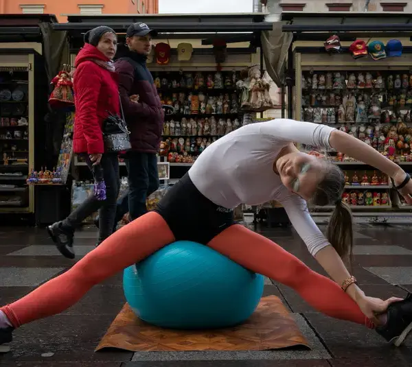 Image of a woman sitting on blue exercise ball