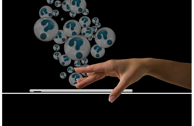 Image by Gerd Altmann of a person pressing a button on her cell phone with question marks coming out of the phone via Pixabay.