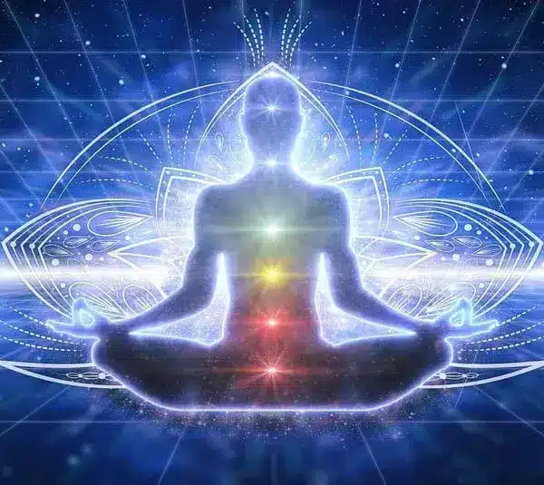 Image of A glowing figure meditates in a lotus position, with colorful chakras aligned, set against a cosmic, grid-like backdrop, evoking serenity, confidence and spiritual energy to represent the solar plexus chakra