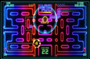 An image from Pac-Man Championship Edition DX, of Pac-Man racing through a neon maze.