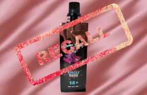 A photo features a brown pouch labeled "Boner Bears Chocolate Syrup" with a black cap and pink cartoon bear, overlaid with a red "RECALL" stamp on a pink background.