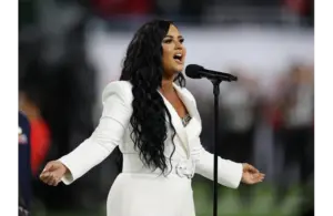 Feb 2, 2020; Miami Gardens, Florida, USA; Recording artist Demi Lovato performs the national anthem prior to the Kansas City Chiefs playing against the San Francisco 49ers in Super Bowl LIV at Hard Rock Stadium. Mandatory Credit: Matthew Emmons-Imagn Images