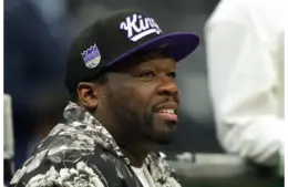 Apr 11, 2025; Sacramento, California, USA; Musical artist 50 Cent sits courtside before the game between the Sacramento Kings and the Los Angeles Clippers at Golden 1 Center. Mandatory Credit: Darren Yamashita-Imagn Images