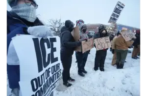 People gather to protest against ICE along W. Market Street in Highland Square in Akron on Jan. 27, 2026. The protest was in reaction to the Jan. 24 death of Alex Pretti, the Minnesota man who was shot by ICE agents. © Mike Cardew / USA TODAY NETWORK via Imagn Images