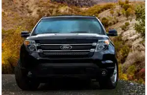 Black Ford Explorer from the front parked on the side of a road with hills behind it. Part of Feb 2026 recall.