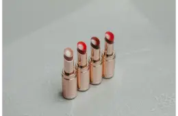 Different lip shades with a golden metal packing
