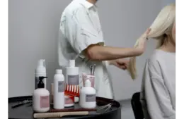 some hair care products and a girl doing treatment