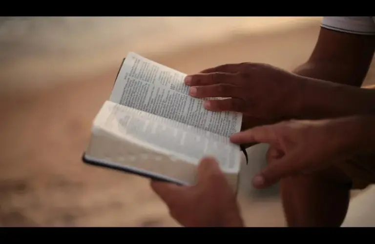 In daily devotion, two men seem to look at a passage in scripture.