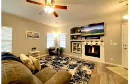 a beautiful living area with a simple and decent mantel decor