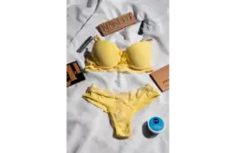 a yellow color lingerie with some makeup products