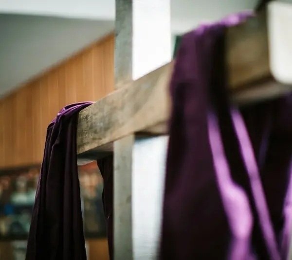 Image of a white wooden cross with purple fabric draped over it, Easter, Lent, Laetare Sunday