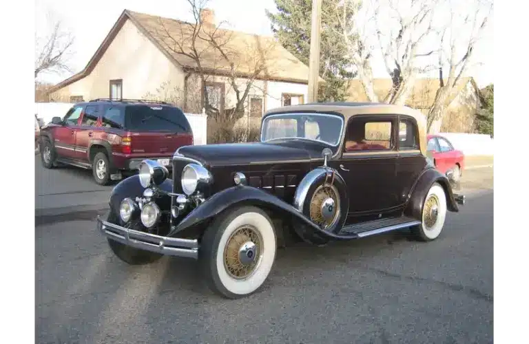 Image of 1931 Reo Royale Victoria Eight parked on the street in front of a house, REO Royale Eight