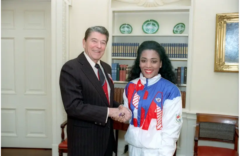 President Reagan greeting Florence Griffith Joyner of the U.S. Olympic team in the Oval Office.