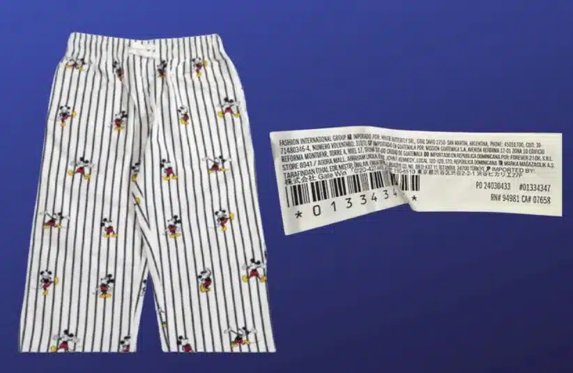 Images of  Forever 21 Kids Disney Mickey Mouse Pajama Pants and tag on a dark blue background