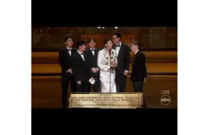 Image of Ejae, Mark Sonnenblick, Joong Gyu Kwak, Yu Han Lee, Hee Dong Nam, Jeong Hoon Seo, and Teddy Park accepting the Oscar for Best Original Song, Golden, KPop Demon Hunters