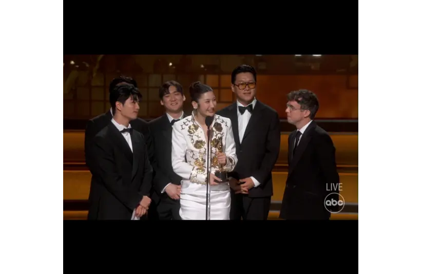 Image of Ejae, Mark Sonnenblick, Joong Gyu Kwak, Yu Han Lee, Hee Dong Nam, Jeong Hoon Seo, and Teddy Park accepting the Oscar for Best Original Song, Golden, KPop Demon Hunters