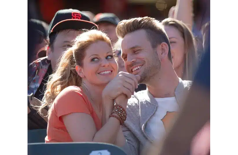 Oct 1, 2015; San Francisco, CA, USA; Actors Candace Cameron Bure and John Brotherton film a scene for the Netflix series Fuller House during the sixth inning between the San Francisco Giants and the Los Angeles Dodgers at AT&T Park. Mandatory Credit: Kelley L Cox-Imagn Images