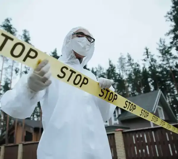 José Jurado Montilla - Man standing behind crime scene tape