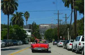 In today's daily Drop, the Hollywood sign is in the background with a red convertible driving towards it