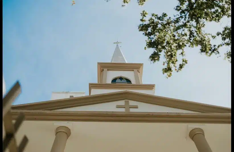 In daily devotion, the top of a church is shown. 