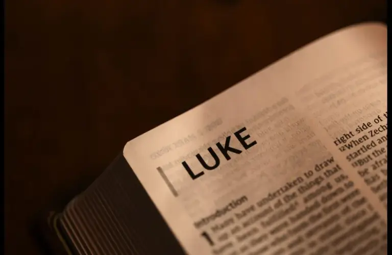 In the triumphal entry story, an open Bible displays Luke.