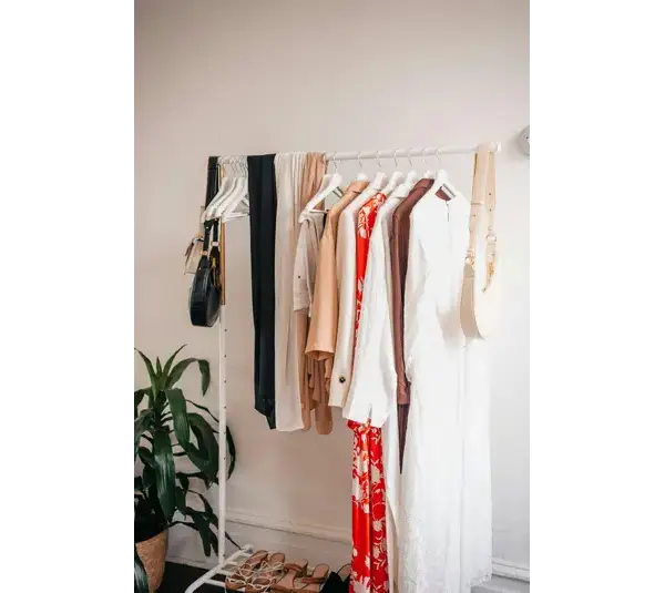 Clothes hanging on a rack representing spring style
