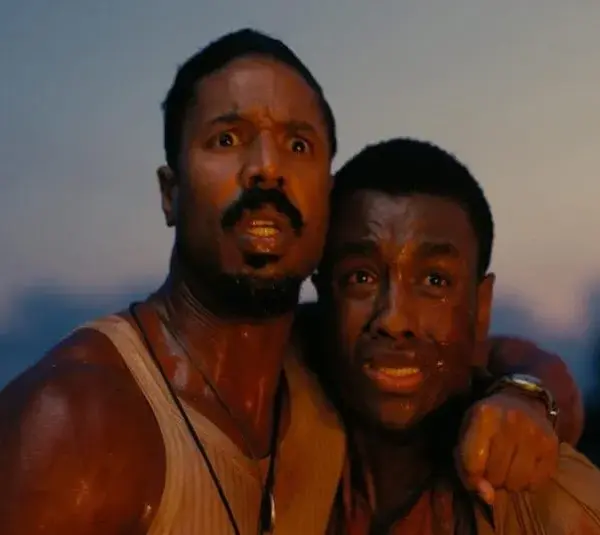 Screenshot of 2026 Oscars nominees Michael B. Jordan and Miles Caton in the movie "Sinners"