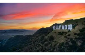 View of the Hollywood Sign with a beautiful sunset in the background. Ready to drop all the celebrity and pop culture news